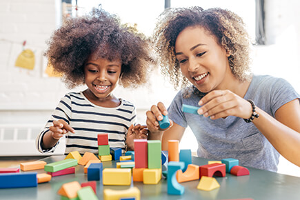 Pediatric occupational therapy - child and mother playing together